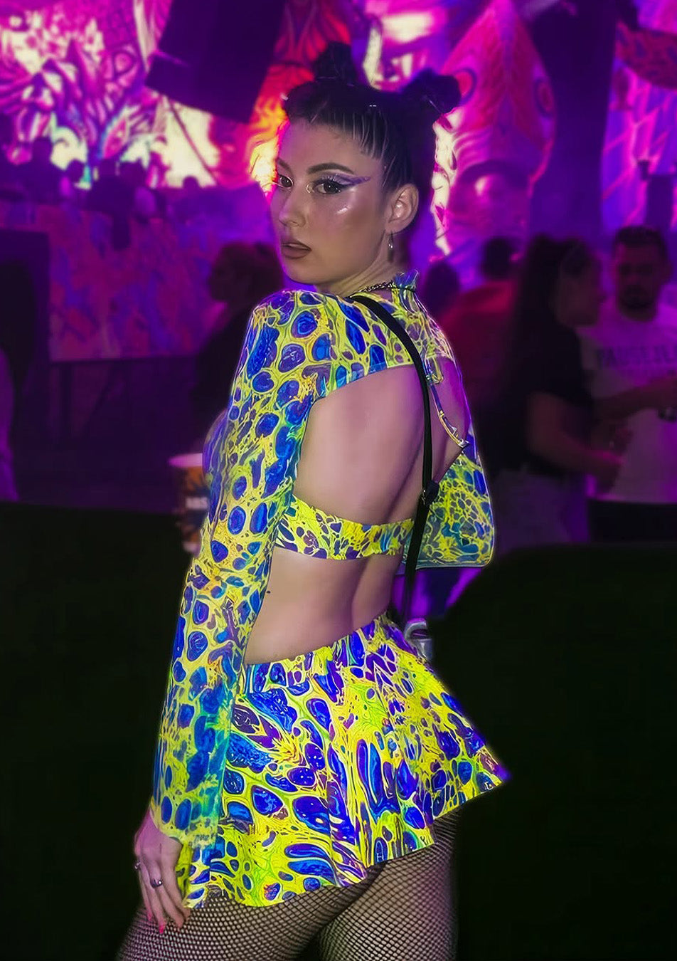 party girl wearing chic neon matching set with a skirt, a top, and sleeves