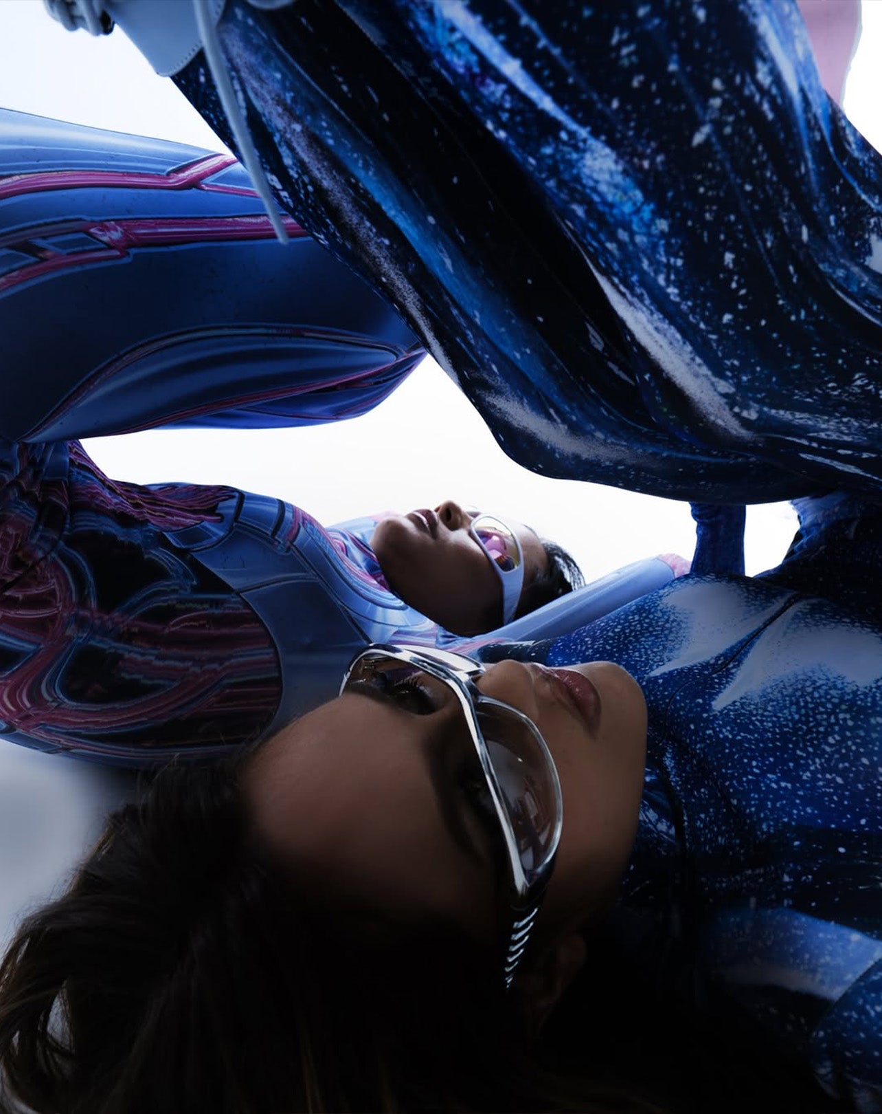 women wearing blue spandex costumes