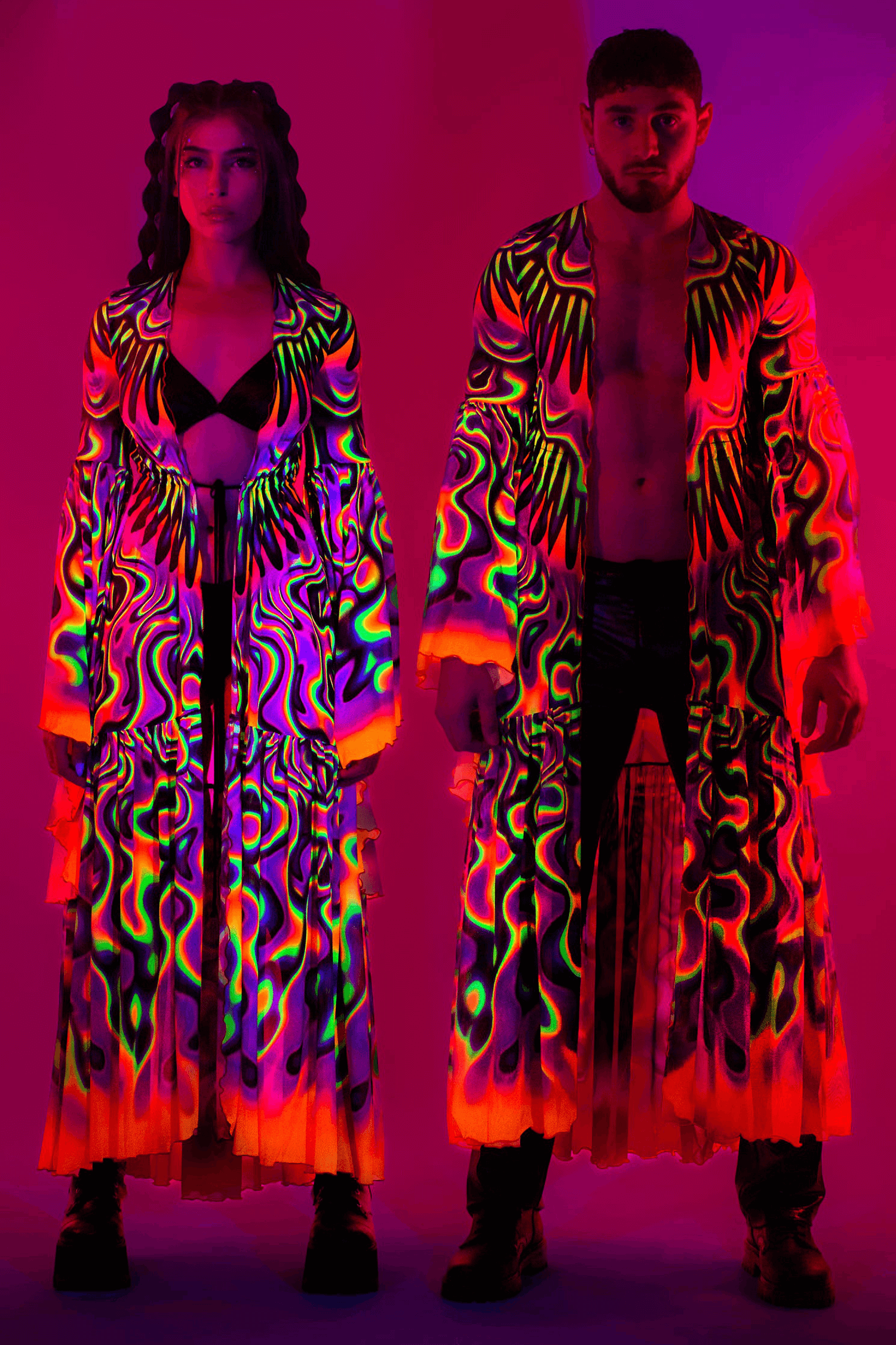Couple in matching uv-reactive outfits in colorful neons