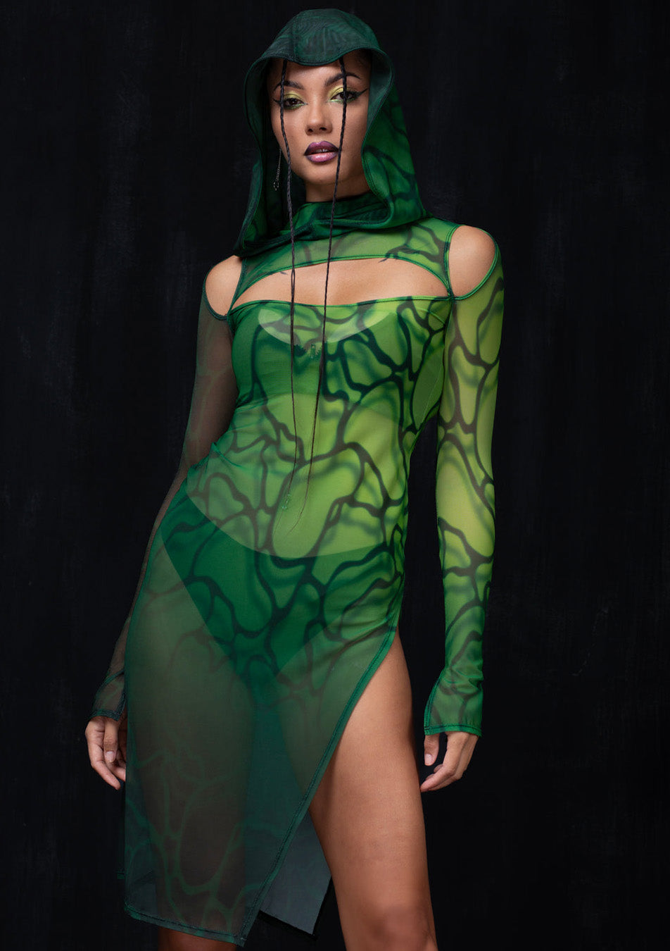 green hooded dress made from sheer mesh