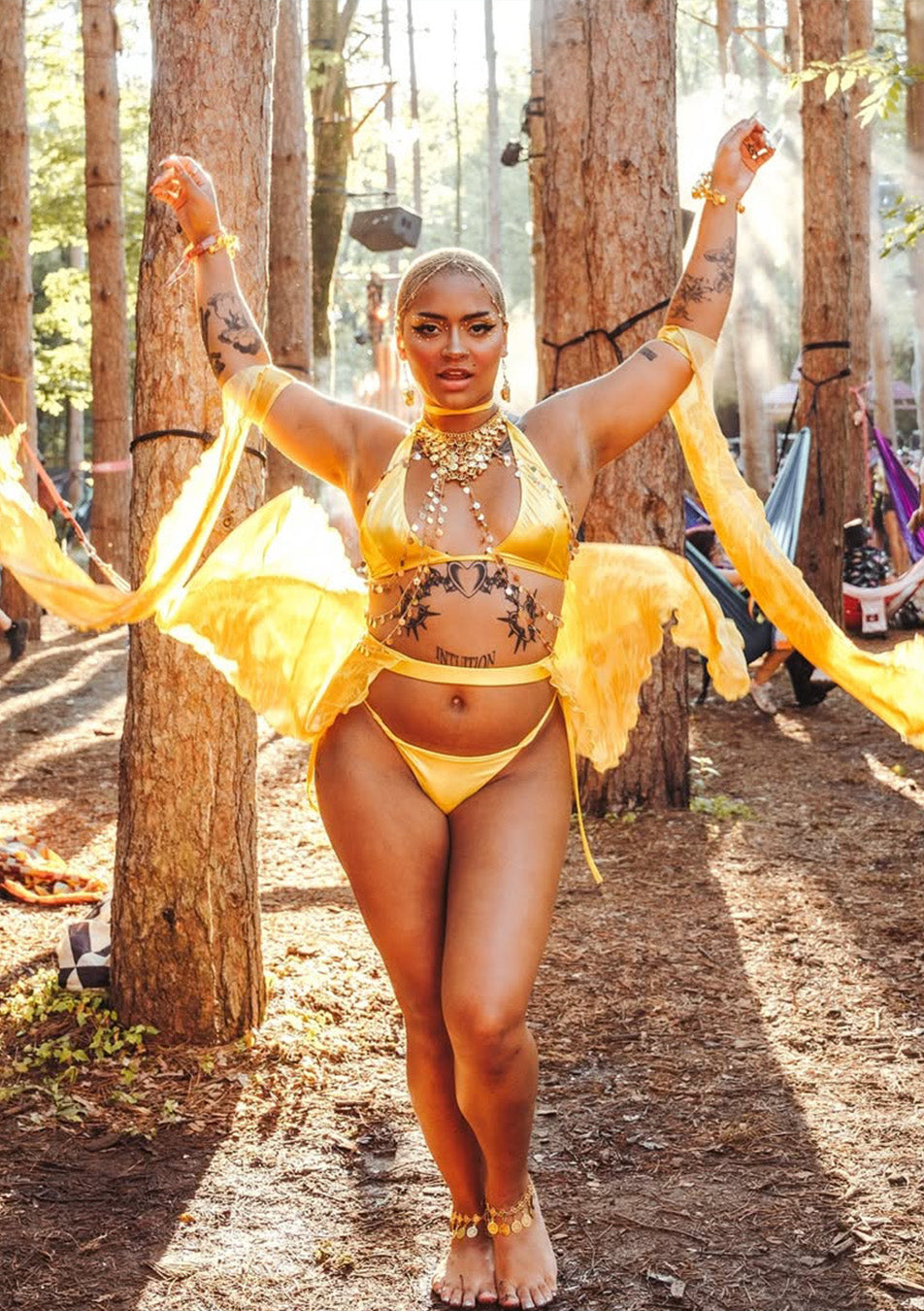 woman in a unique gold festival set containing multiple parts