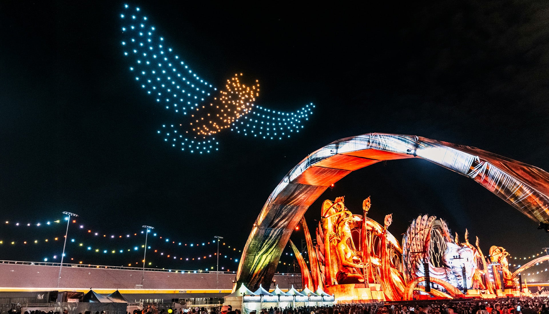 EDM festival light show with flying bird