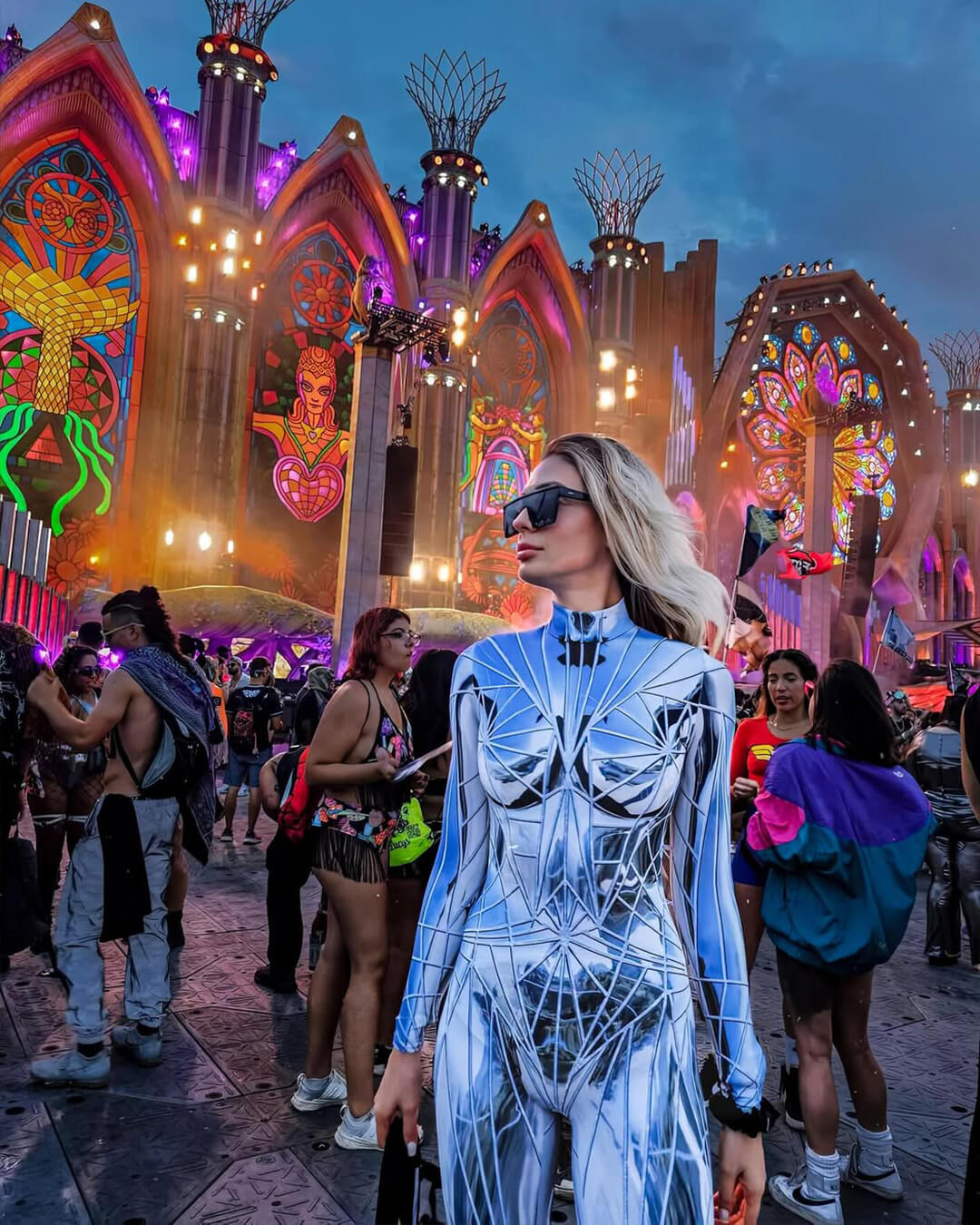 woman attending a rave in reflective full-body costume from BADINKA