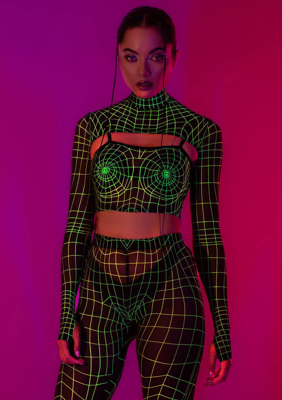 a girl wearing glow-in-the-dark neon uv reflecting tech leggings and sleeved top