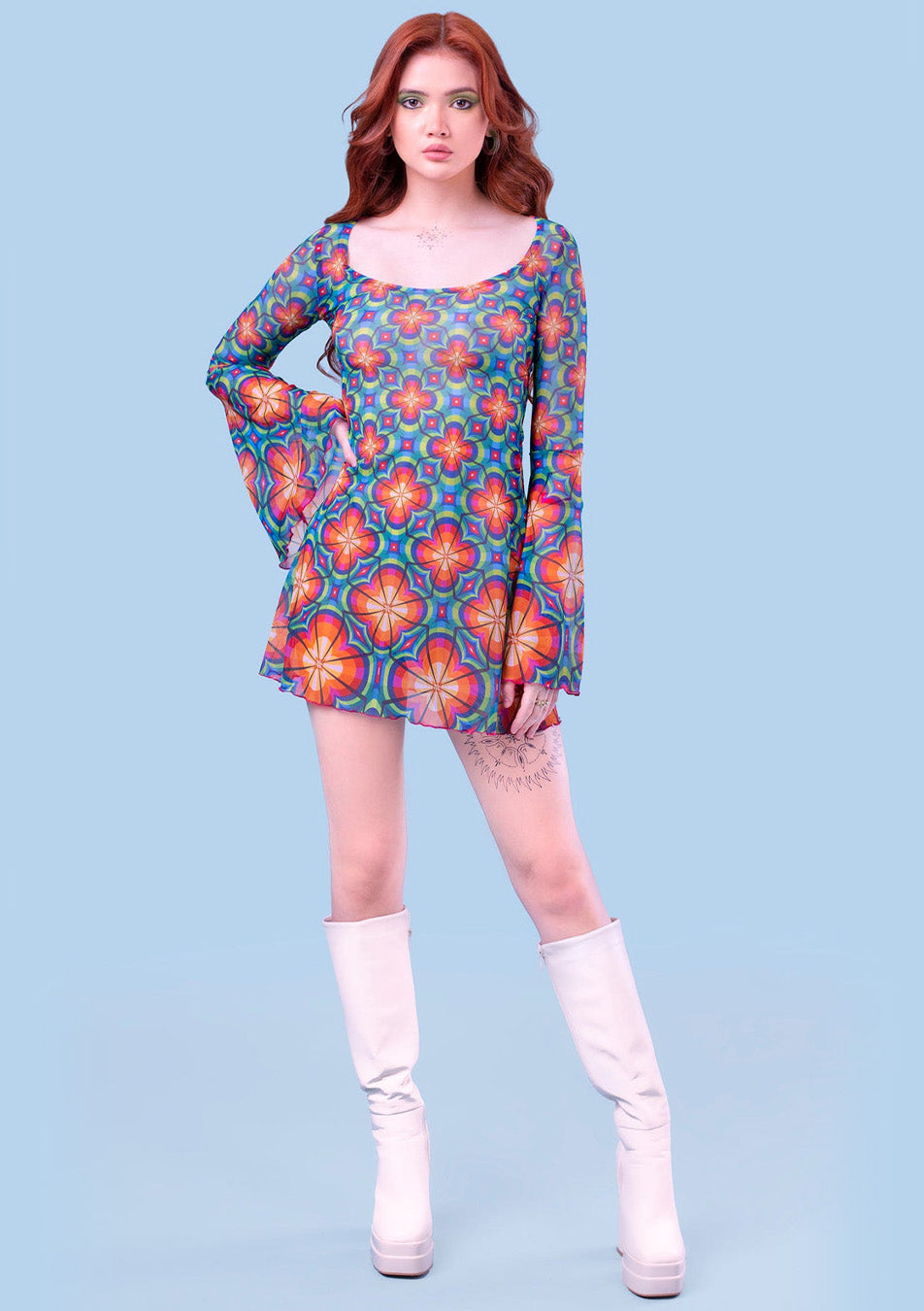 woman wearing a colorful mesh mini dress in blue and orange