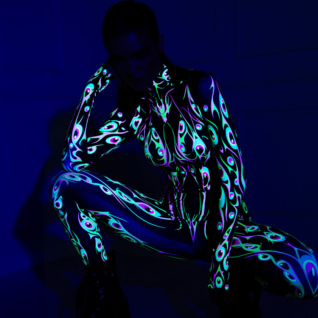 Woman deciding what to be for Halloween in printed uv-reactive costume