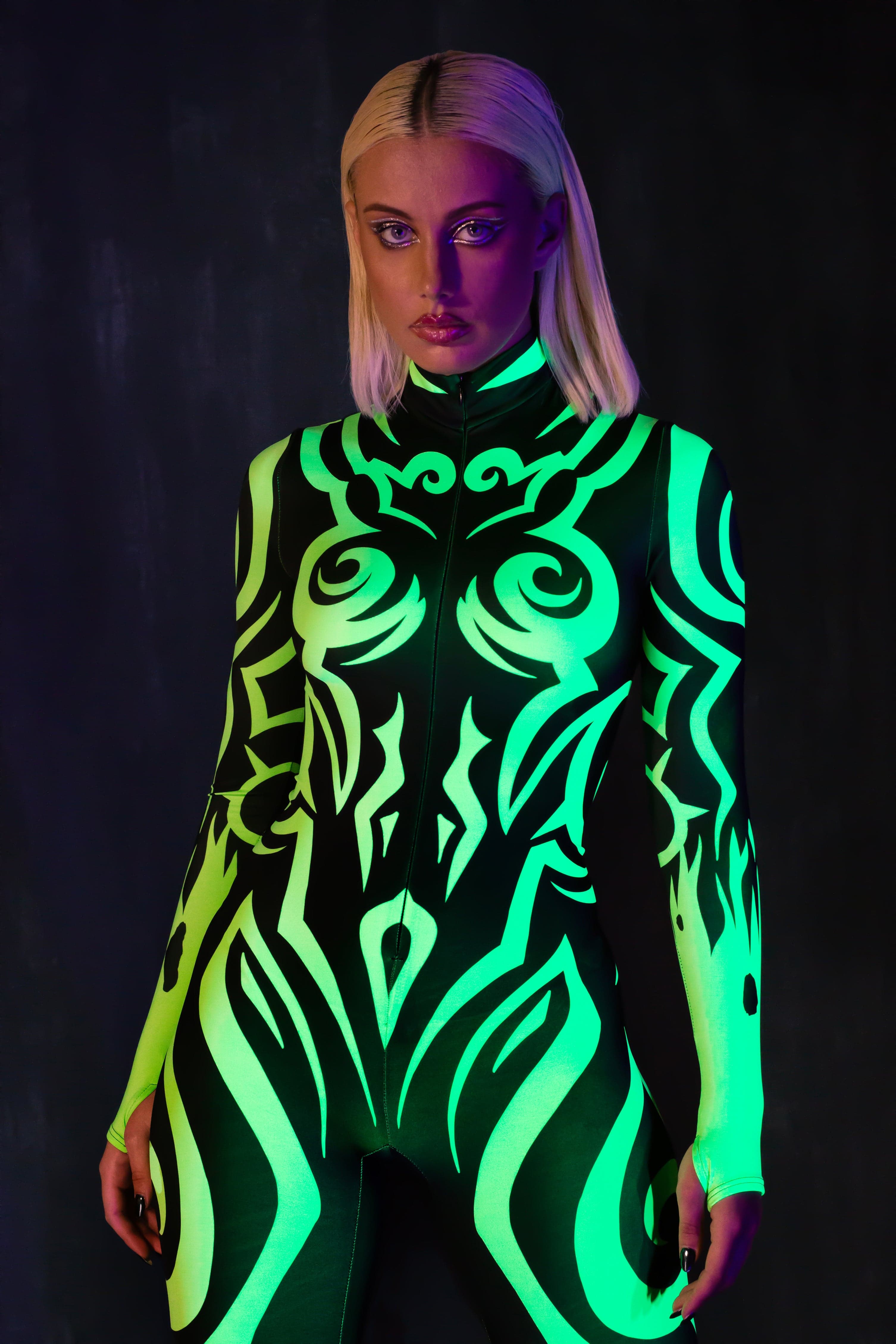 BADINKA black and green Lycra bodysuit with UV-reactive graphic details; women's design for Halloween; close-up front view