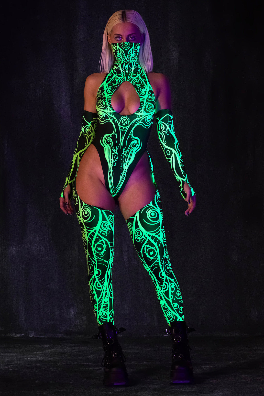 a neon mesh catsuit that glows under blacklight