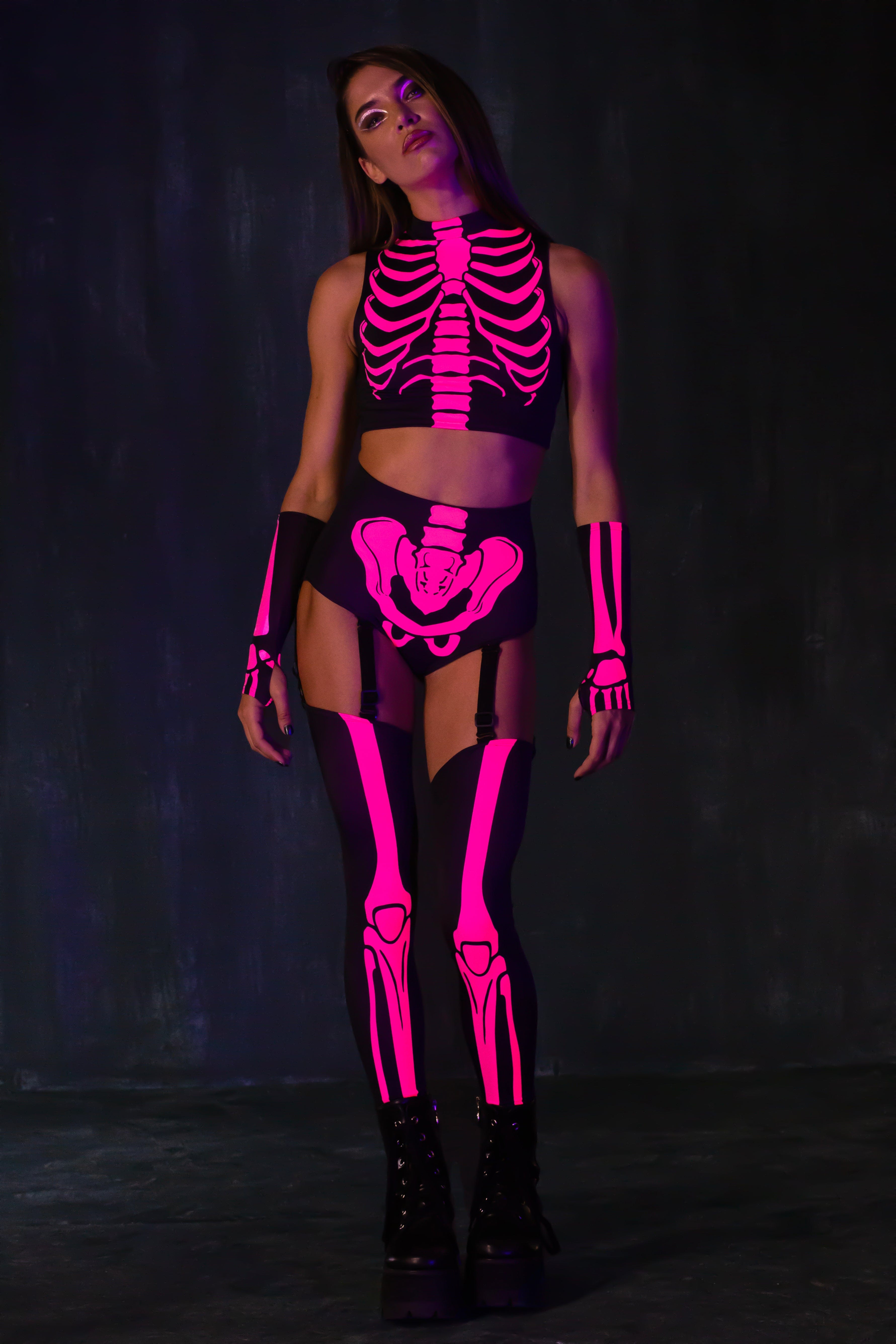 BADINKA pink glow-in-the-dark skeleton set with a sleeveless top and garter shorts; women's Halloween design; front view