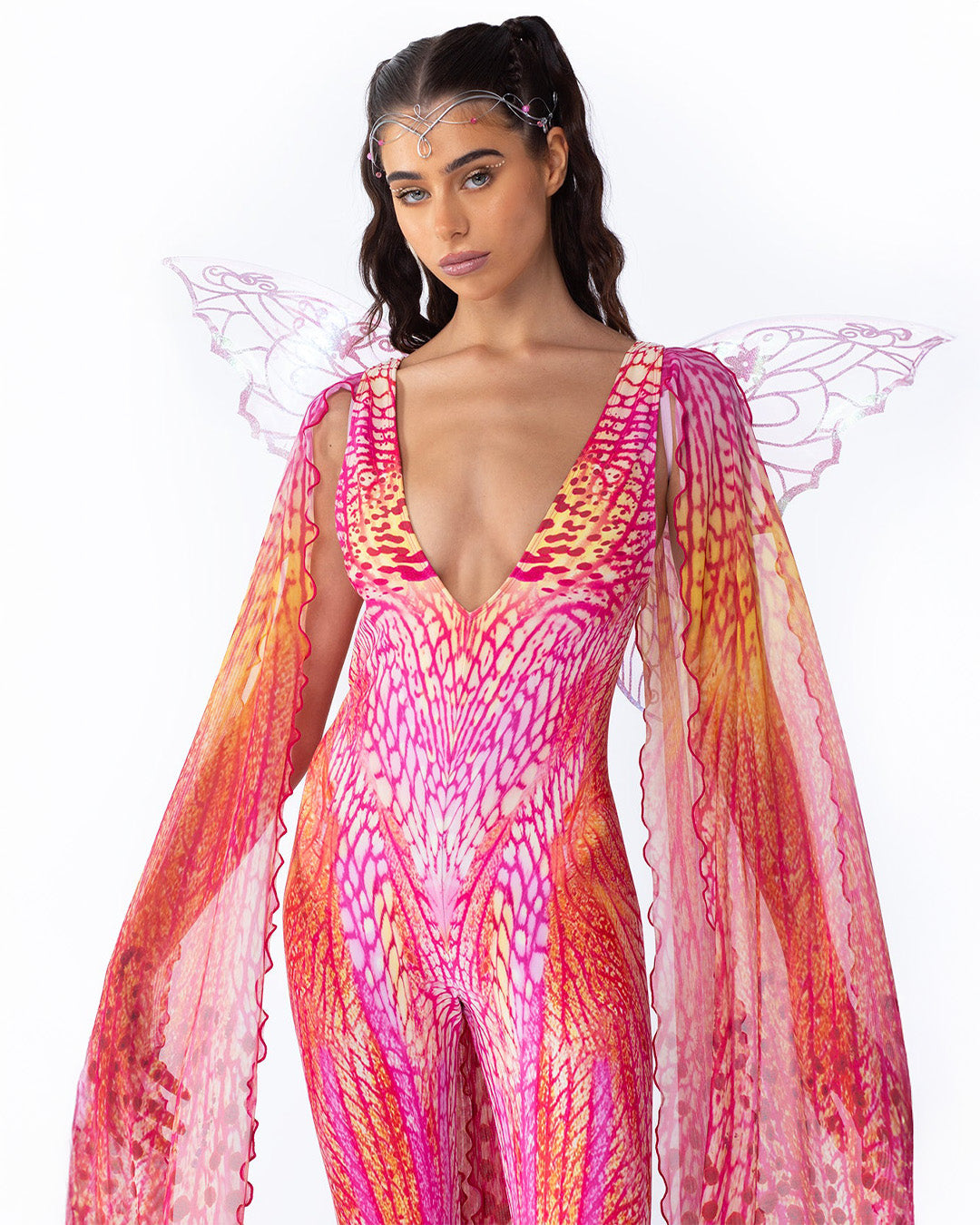 a festival outfit idea with a pink winged catsuit