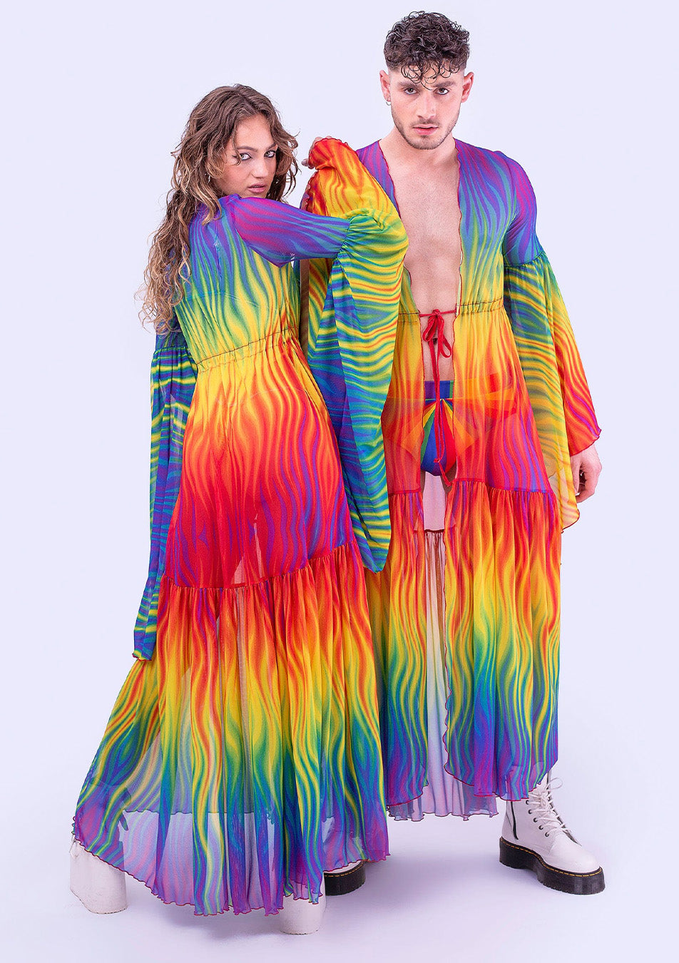 Couple wearing matching rainbow outfits for the Pride Paarade