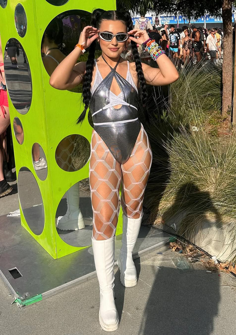 woman wearing a silver halter bodysuit with reflective metallic fabrics