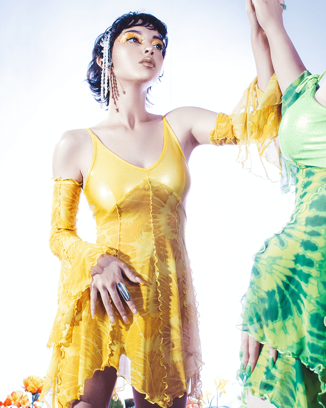 woman wearing a yellow faity dress with buttercup tupil design 