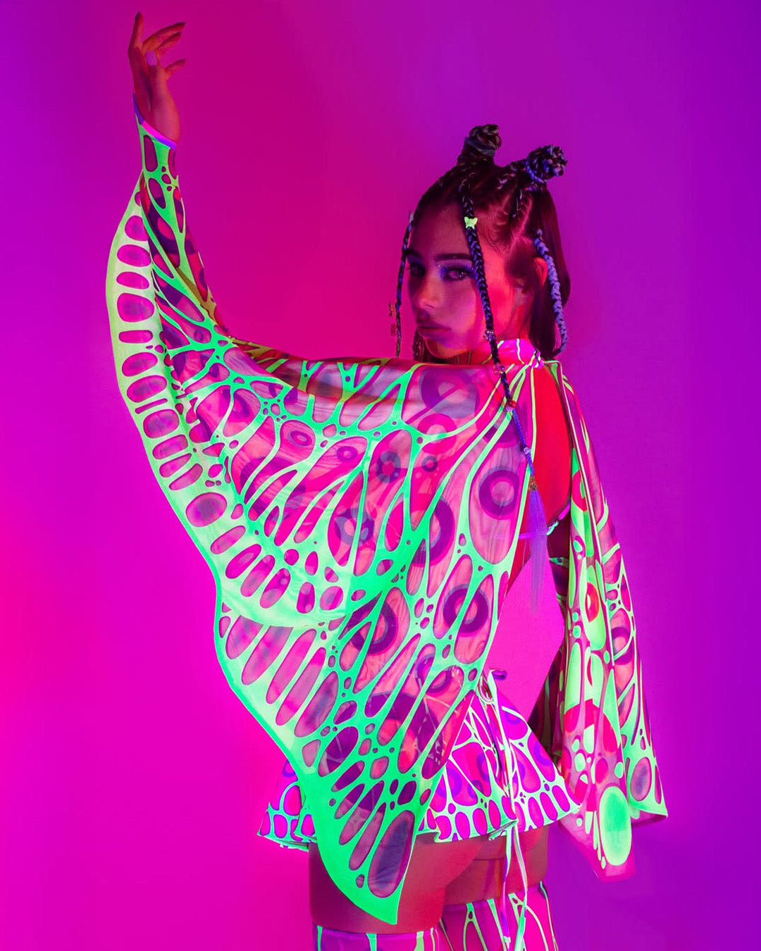 woman wearing an EDM festival outfit with neon UV reactive wings