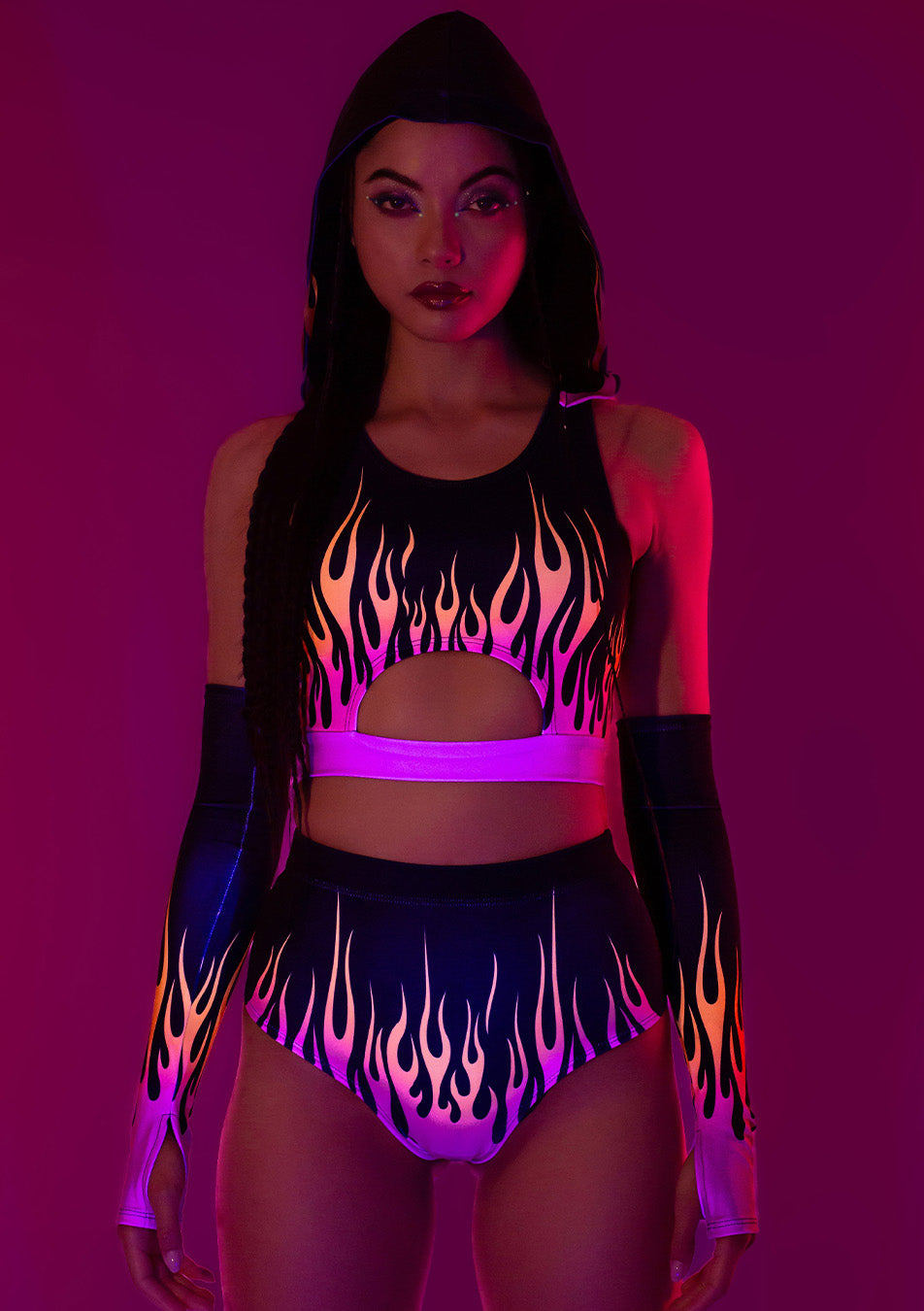 a girl wearing glow-in-the-dark neon uv reflecting set Firestarter with hooded top and shorts