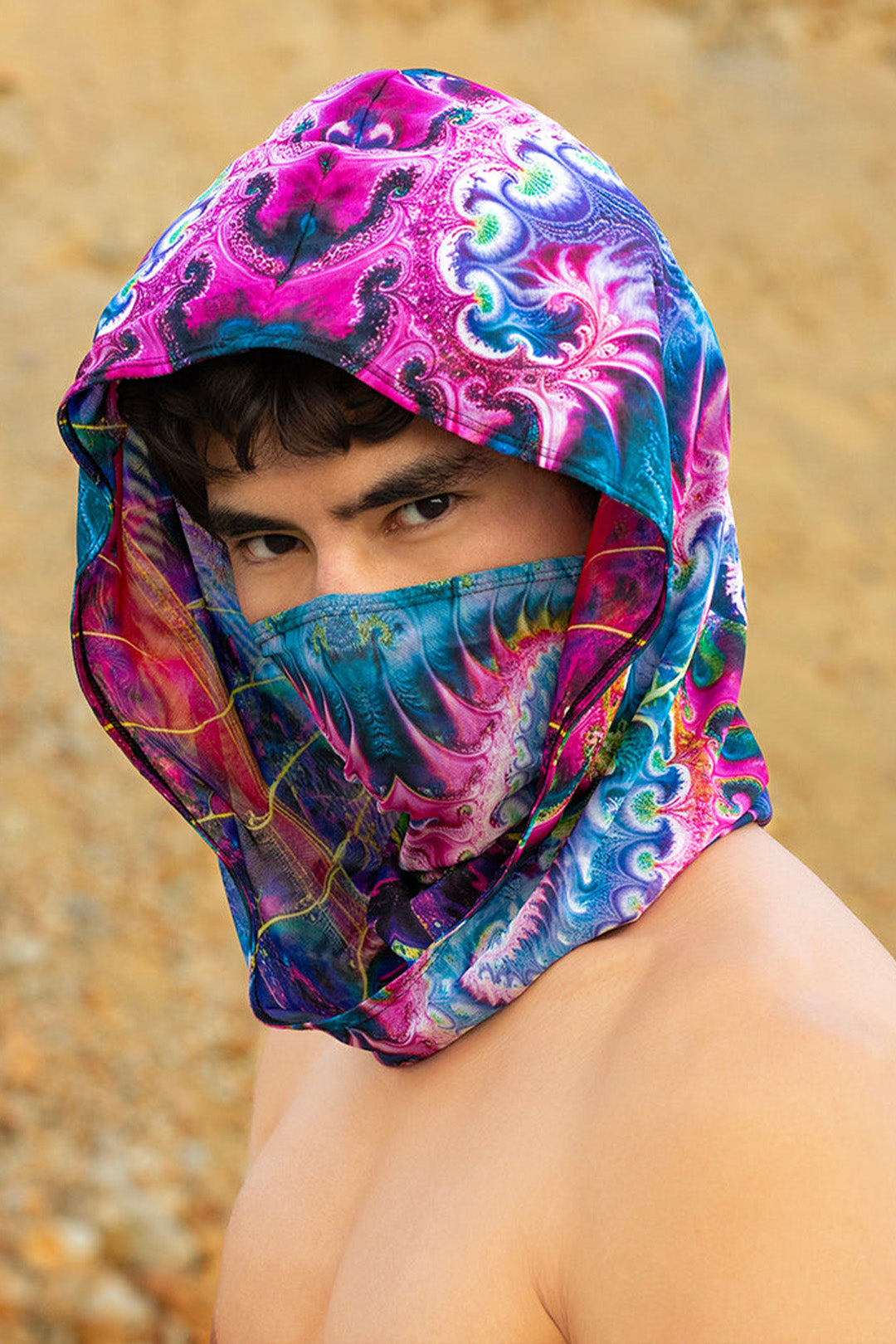 man wearing a unisex double sided hood with psychedelic prints