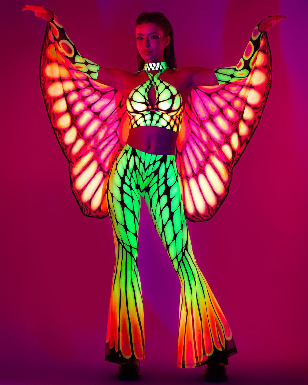 glowing UV festival wear set with bell pants, a halter top, and fairy wings