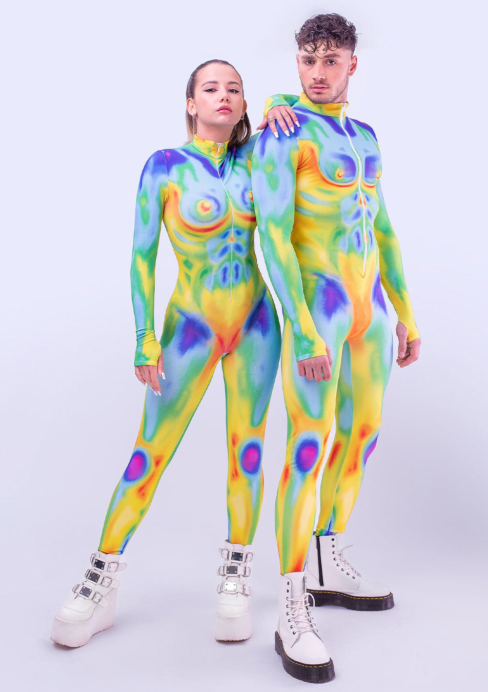 Two people in matching Pride outfits that create a staggering look