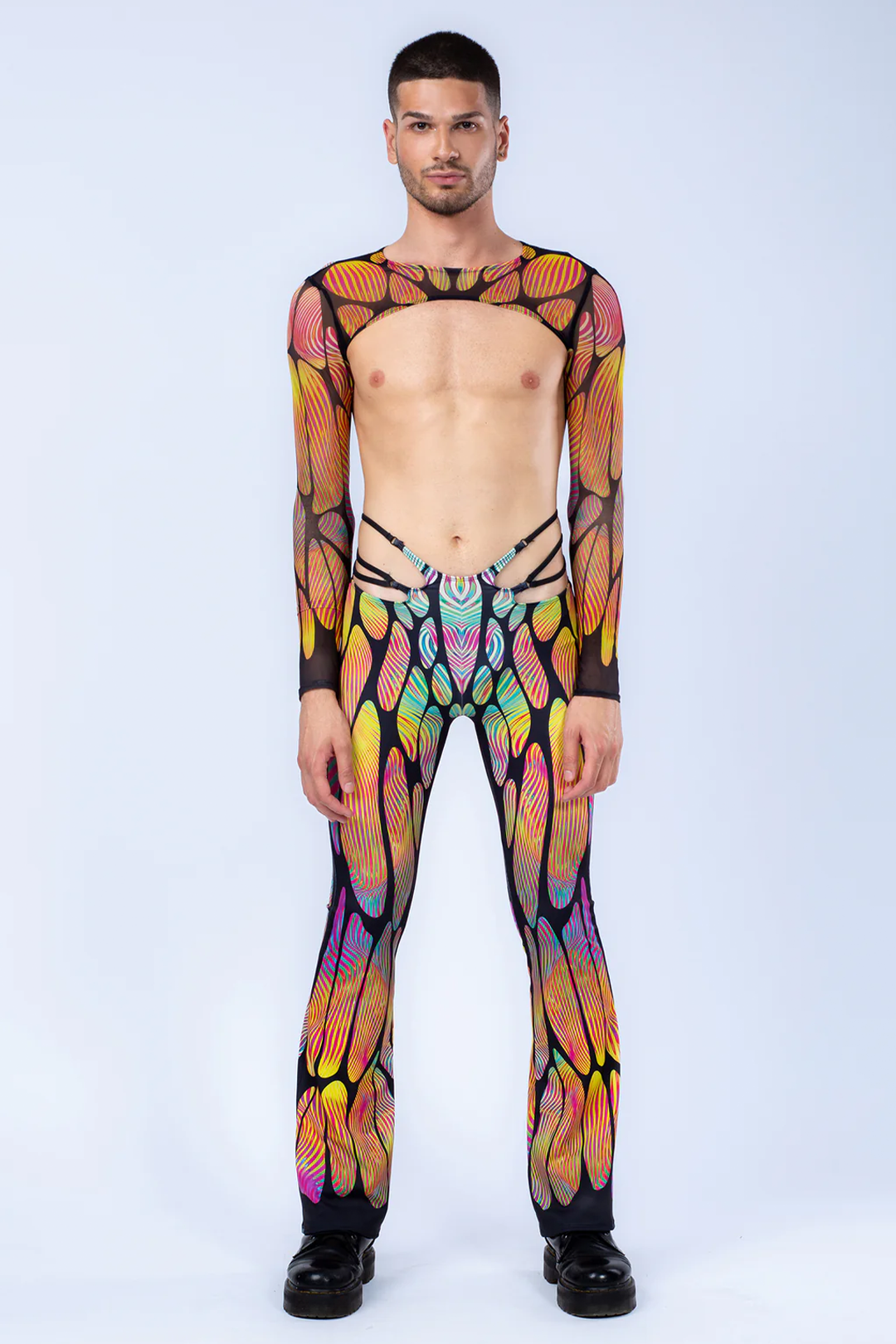 man wearing butterfly printed Male Mesh Shrug and cut-out pants