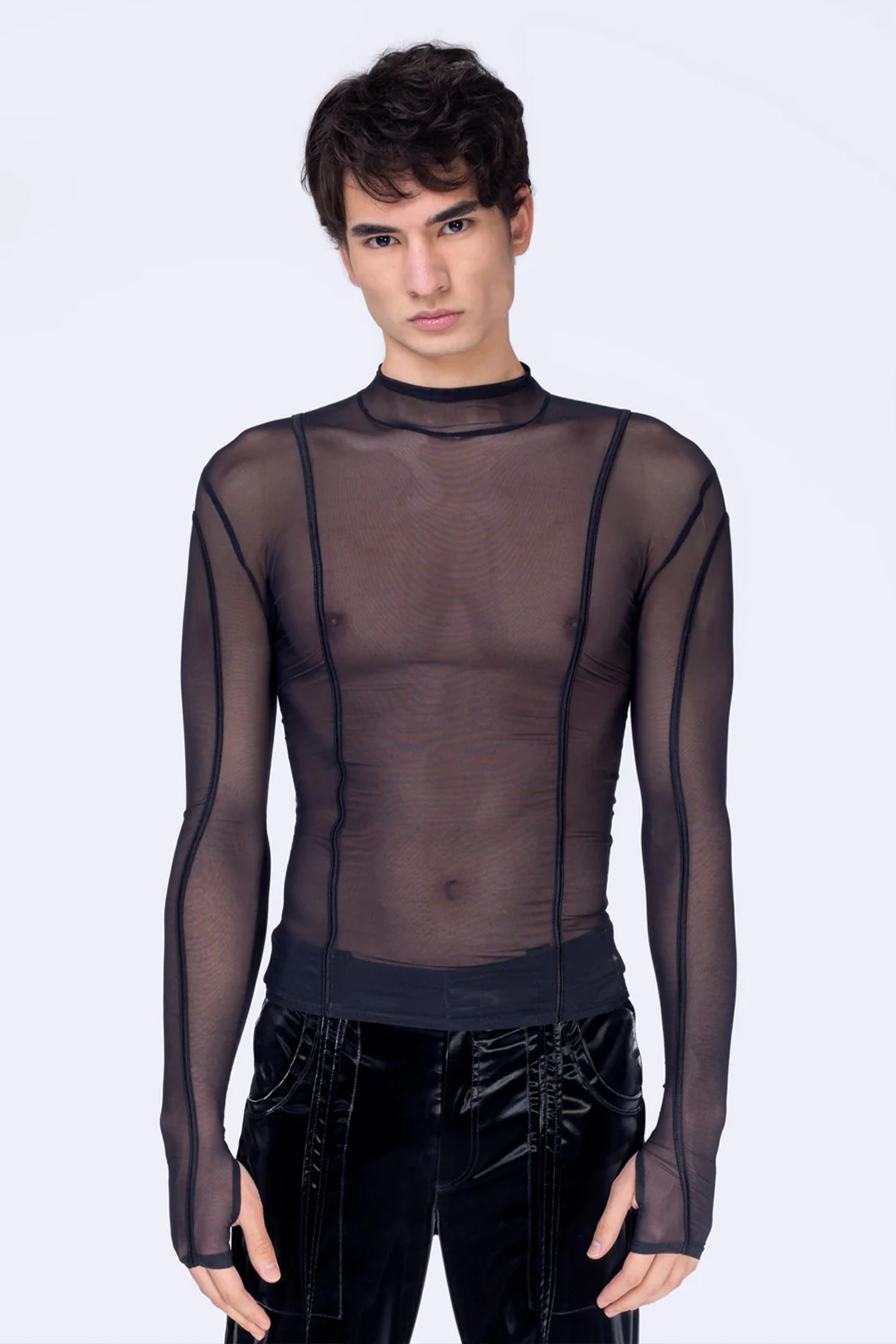 a man wearing techno mesh see-through black shirt